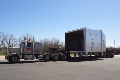 Oversize load on an extendable drop deck flatbed trailer